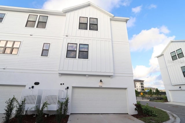 view of side of home featuring a garage