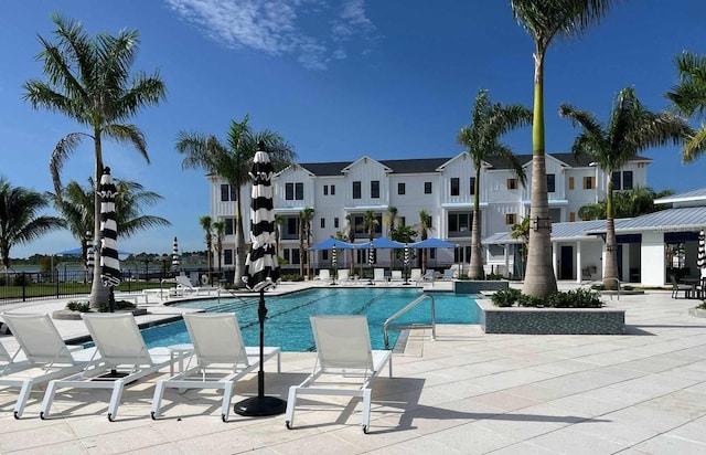 view of swimming pool featuring a patio area