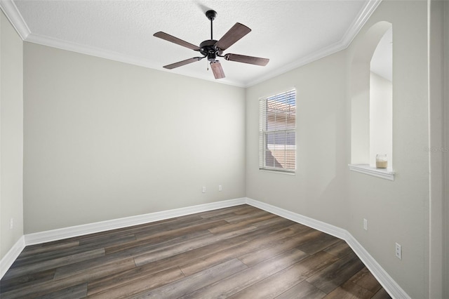 unfurnished room featuring crown molding, dark wood-type flooring, and a textured ceiling