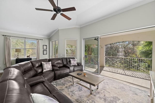 living room with lofted ceiling, crown molding, and ceiling fan