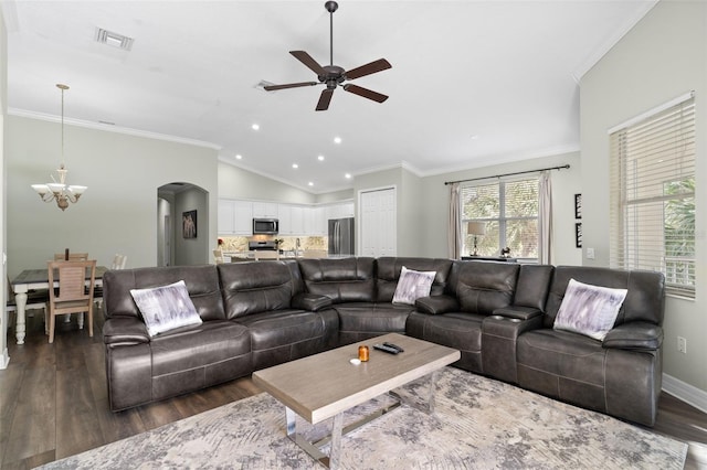 living room with crown molding, vaulted ceiling, ceiling fan with notable chandelier, and dark hardwood / wood-style flooring