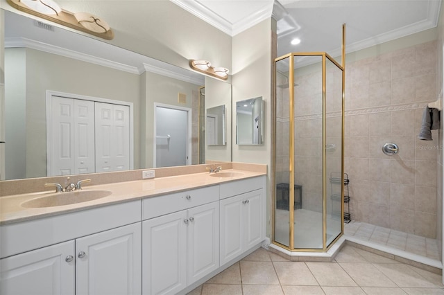 bathroom featuring crown molding, vanity, tile patterned flooring, and a tile shower