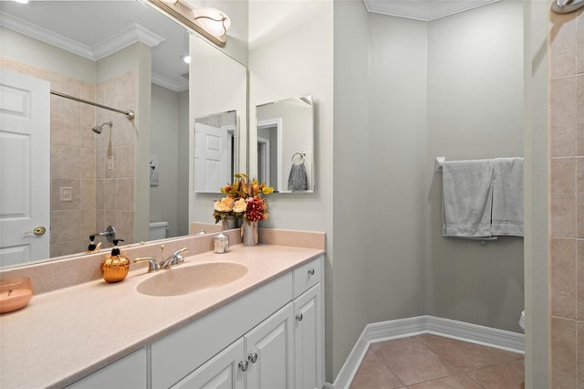 bathroom with vanity, crown molding, tile patterned floors, and toilet