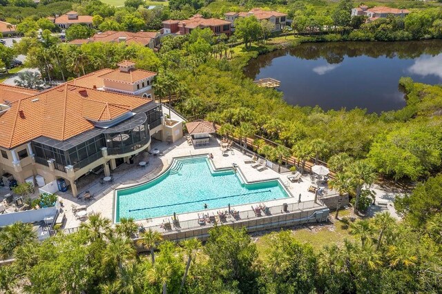 birds eye view of property with a water view