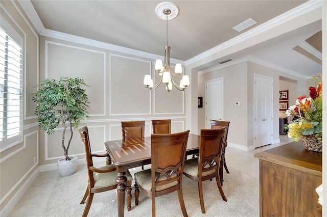 dining area featuring a healthy amount of sunlight, ornamental molding, and an inviting chandelier