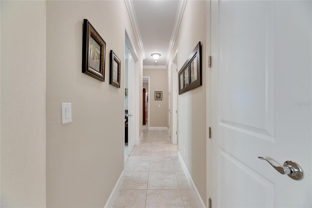 corridor featuring ornamental molding and light tile patterned flooring