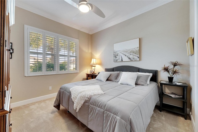 bedroom with ceiling fan, crown molding, and light colored carpet