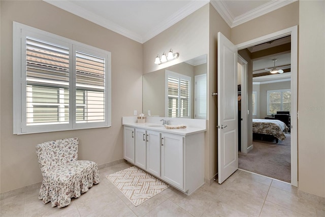 bathroom featuring tile patterned flooring, plenty of natural light, ornamental molding, and vanity