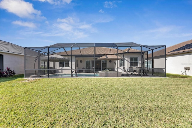 back of house with a lawn and glass enclosure