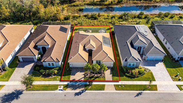 birds eye view of property featuring a water view