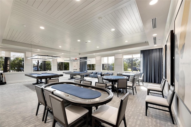 dining space with a tray ceiling, wooden ceiling, light colored carpet, and billiards