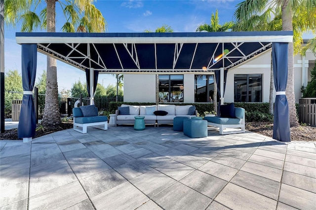 view of patio / terrace with outdoor lounge area and a gazebo