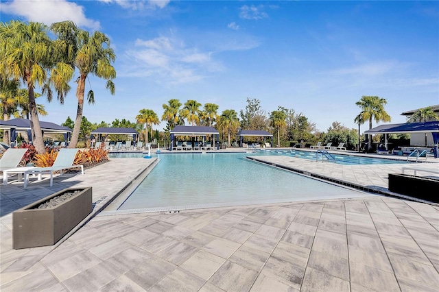 view of swimming pool with a patio area