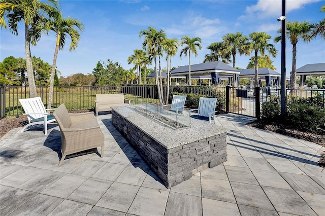 view of patio with a gazebo and an outdoor fire pit