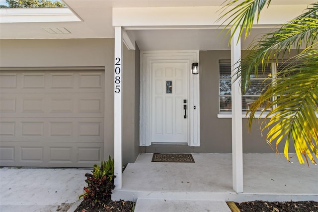 entrance to property featuring a garage