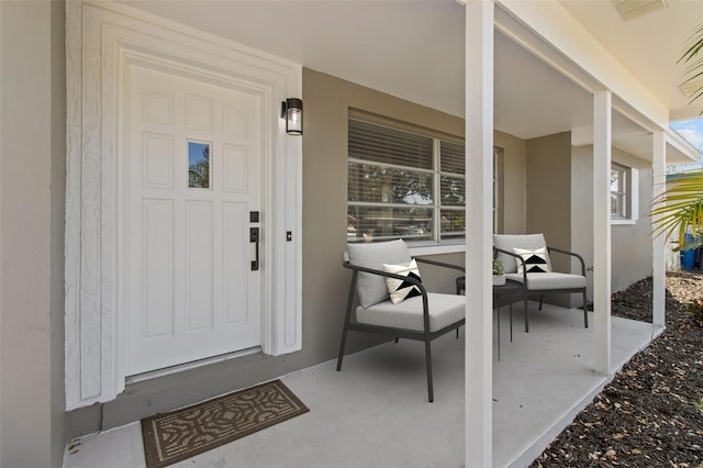 property entrance featuring a porch