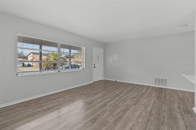 spare room featuring light wood-type flooring