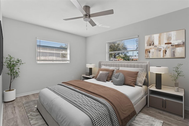 bedroom featuring ceiling fan and light hardwood / wood-style flooring