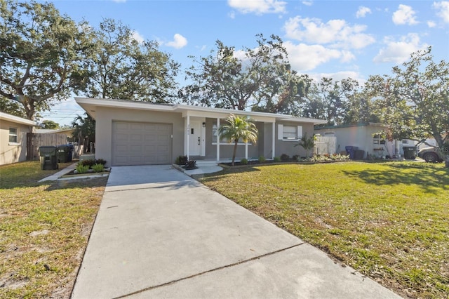 ranch-style home with a garage and a front yard