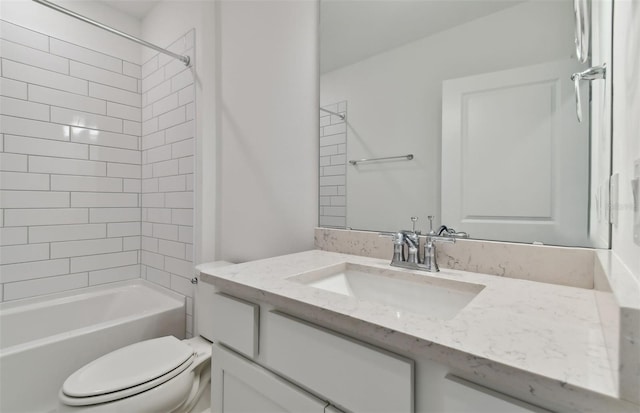 full bathroom featuring vanity, toilet, and tiled shower / bath combo