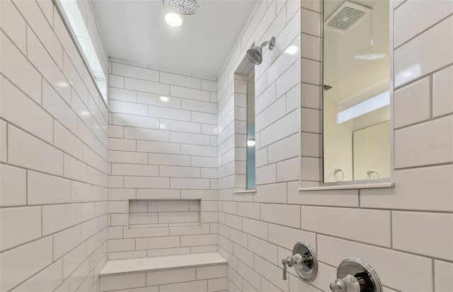 bathroom featuring a tile shower