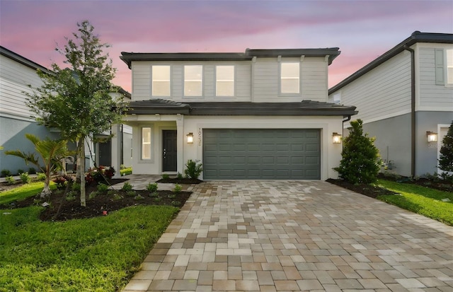 10328 Cross River Trl, Parrish, FL 34219 - traditional home with an attached garage and decorative driveway