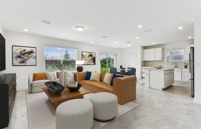 10328 Cross River Trl, Parrish, FL 34219 - living room with recessed lighting, marble finish floor, and visible vents
