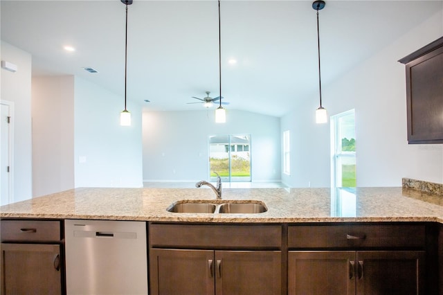 kitchen featuring light stone counters, stainless steel dishwasher, ceiling fan, sink, and lofted ceiling