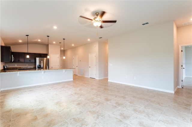 449 Grant Blvd, Lehigh Acres, FL 33974 - unfurnished living room featuring recessed lighting, ceiling fan, light tile patterned flooring, vaulted ceiling, and baseboards