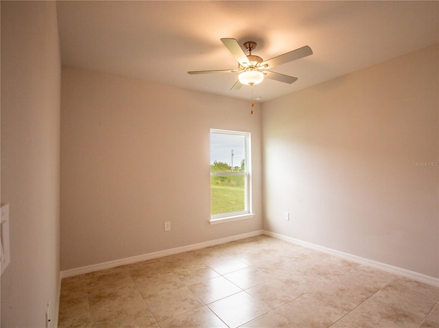 tiled empty room with ceiling fan