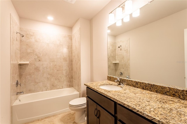 full bathroom with vanity, toilet, and tiled shower / bath