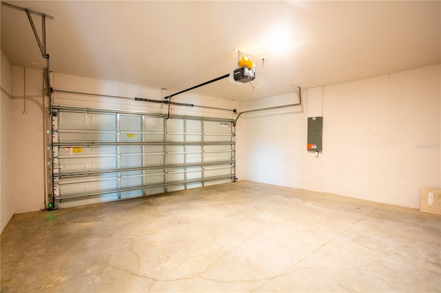 garage featuring electric panel and a garage door opener