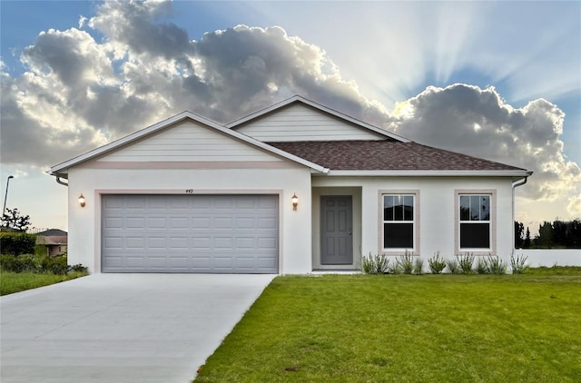 449 Grant Blvd, Lehigh Acres, FL 33974 - single story home with concrete driveway, a front lawn, an attached garage, and stucco siding