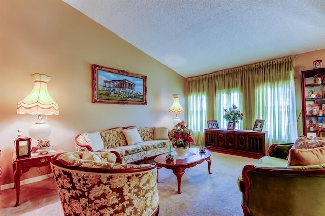 carpeted living room with a textured ceiling and vaulted ceiling