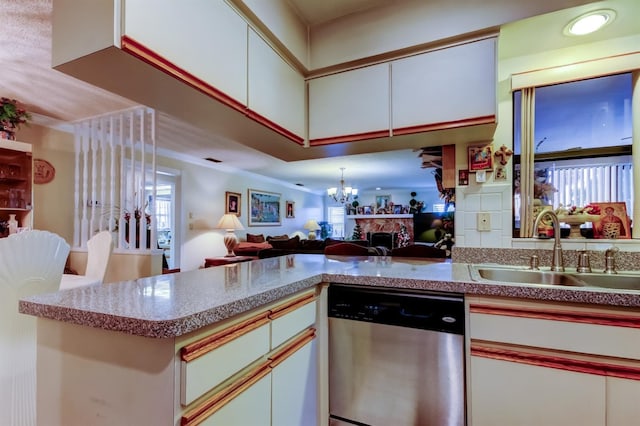 kitchen with kitchen peninsula, dishwasher, white cabinets, and sink