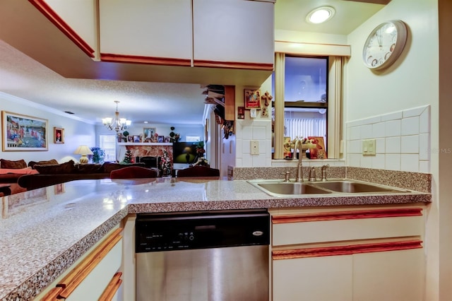 kitchen featuring stainless steel dishwasher, ornamental molding, sink, white cabinets, and a chandelier