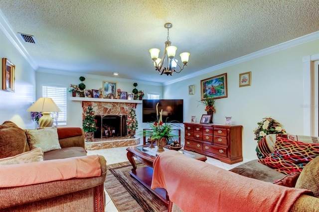 living room featuring a stone fireplace, an inviting chandelier, a textured ceiling, and ornamental molding