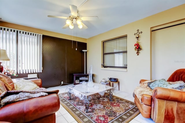 living room featuring ceiling fan and light tile patterned flooring