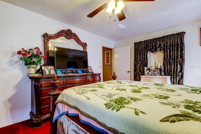 bedroom featuring a textured ceiling and ceiling fan