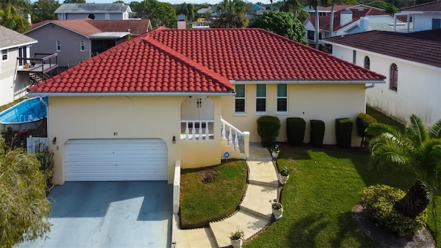 mediterranean / spanish-style home featuring a garage