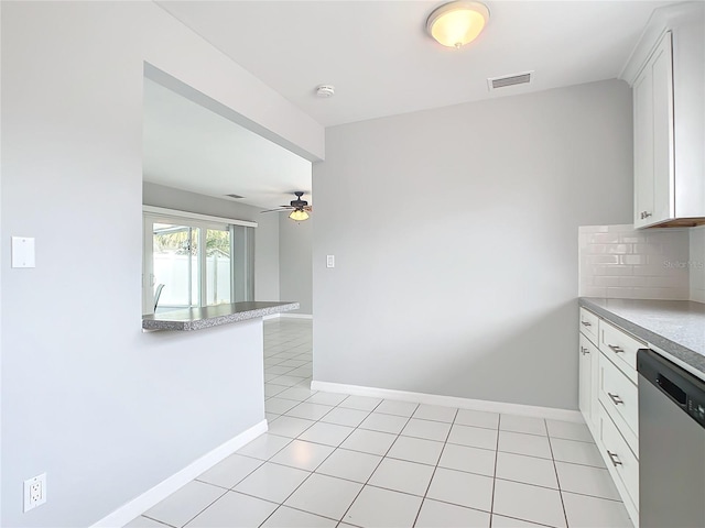 kitchen with decorative backsplash, kitchen peninsula, ceiling fan, dishwasher, and white cabinets