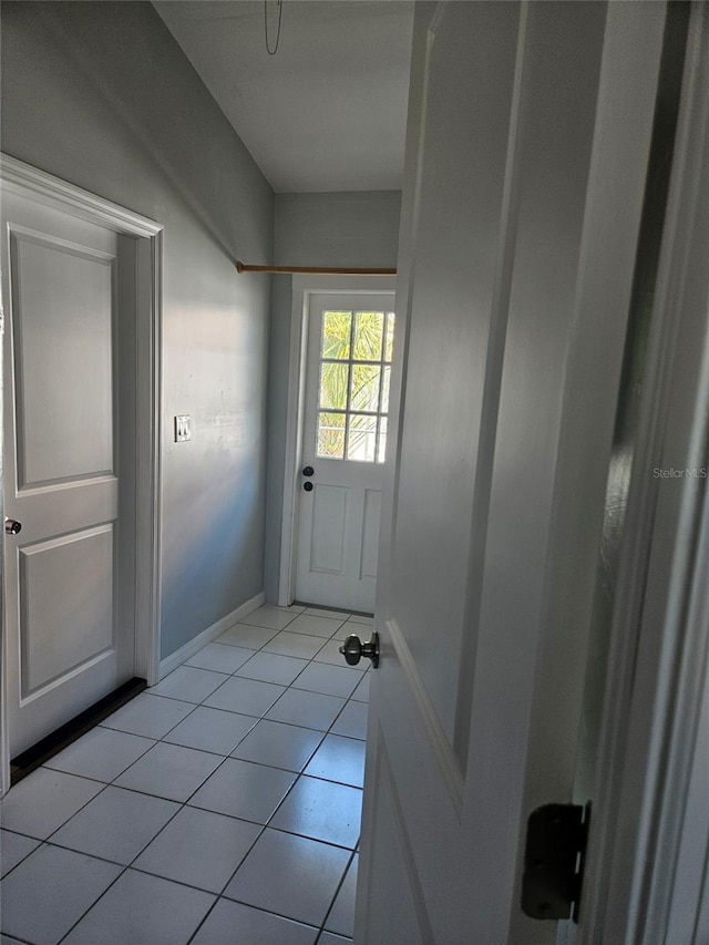 doorway featuring light tile patterned floors