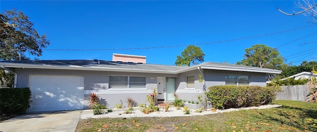 ranch-style house featuring a garage