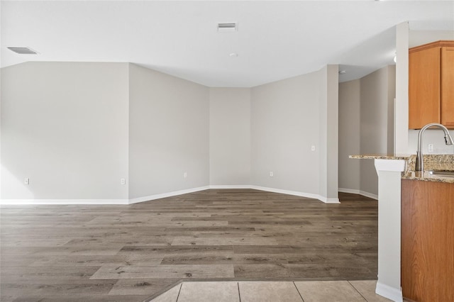 interior space featuring light wood-type flooring and sink