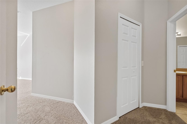 hallway featuring carpet flooring