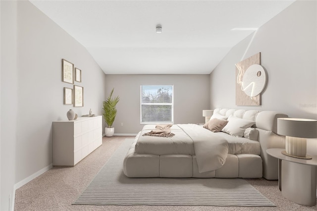 bedroom featuring light colored carpet and vaulted ceiling