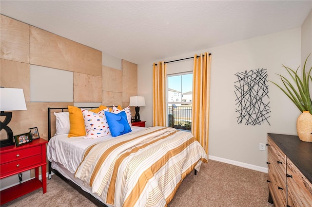 carpeted bedroom featuring access to exterior