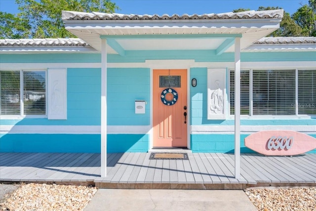 doorway to property with a porch