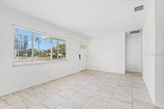 empty room featuring light tile patterned floors