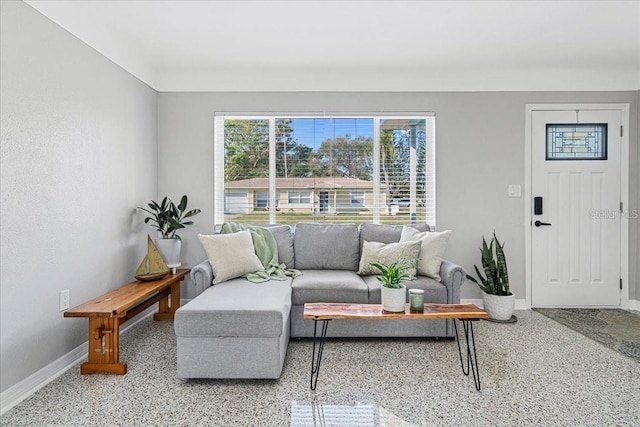 living room featuring baseboards